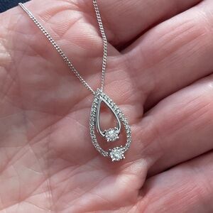 Diamond Pendent, Double teardrop. Diamonds, surrounded by Diamonds
10kt Pendent